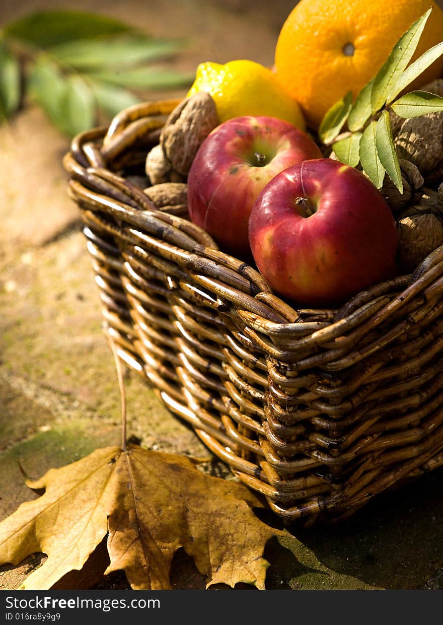 Apples, lemon and orange with walnuts. Apples, lemon and orange with walnuts