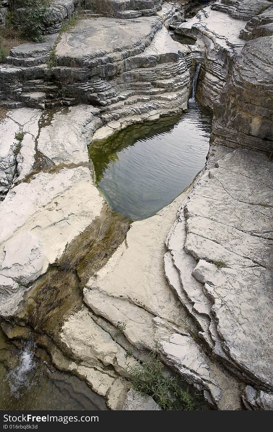 Small lake at the canyon near the village of Papigo on Pindos mount. Small lake at the canyon near the village of Papigo on Pindos mount