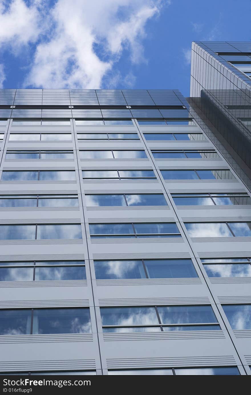 Glass building with reflections of sky