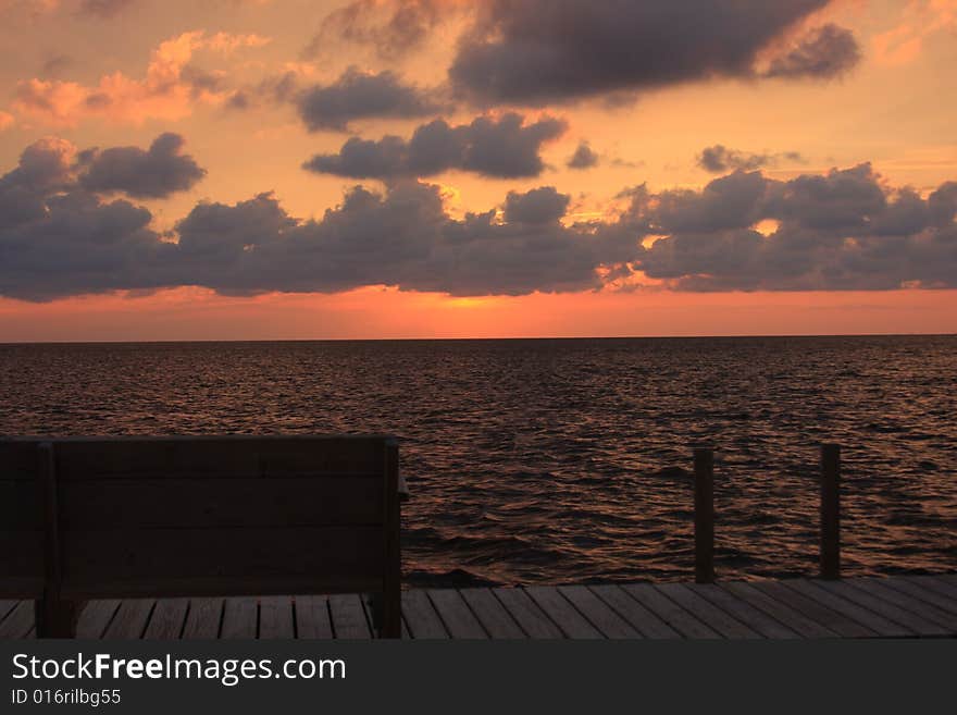 Bench and Sunset located on the Pamlico Sound in the Outer Banks, North Carolina