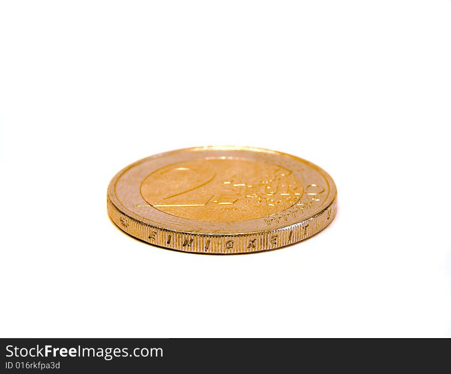 Two euro coin in front of a white background/isolated