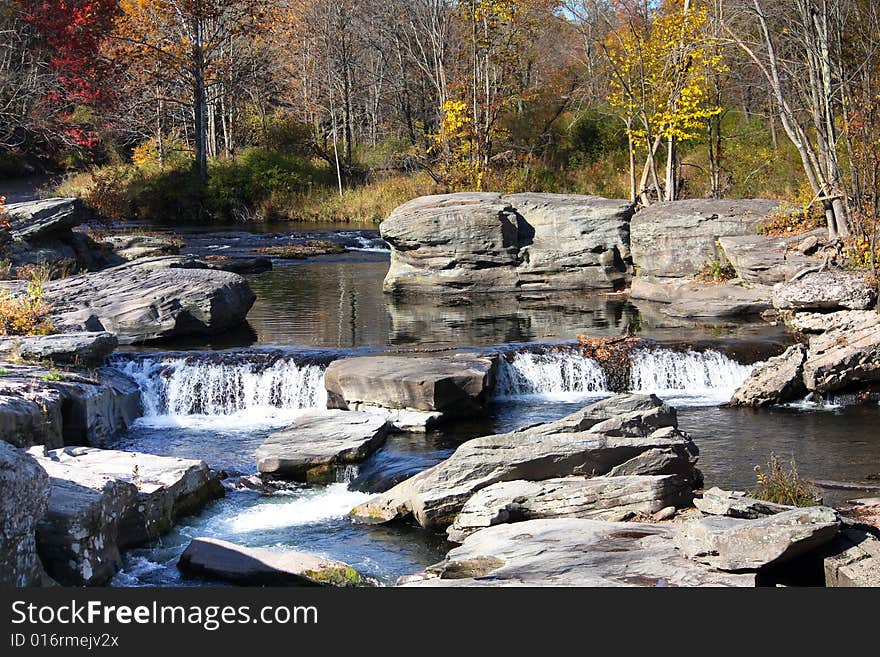 Clean mountain water rushing down the river in October. Clean mountain water rushing down the river in October