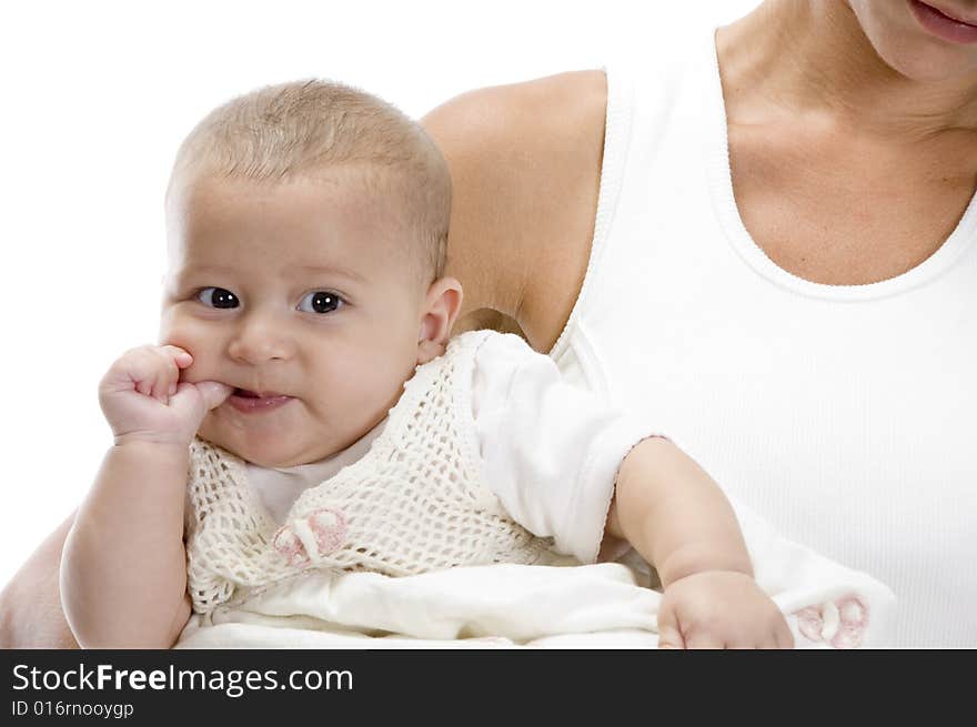 Mother holding little baby and naughty baby sucking his thumb