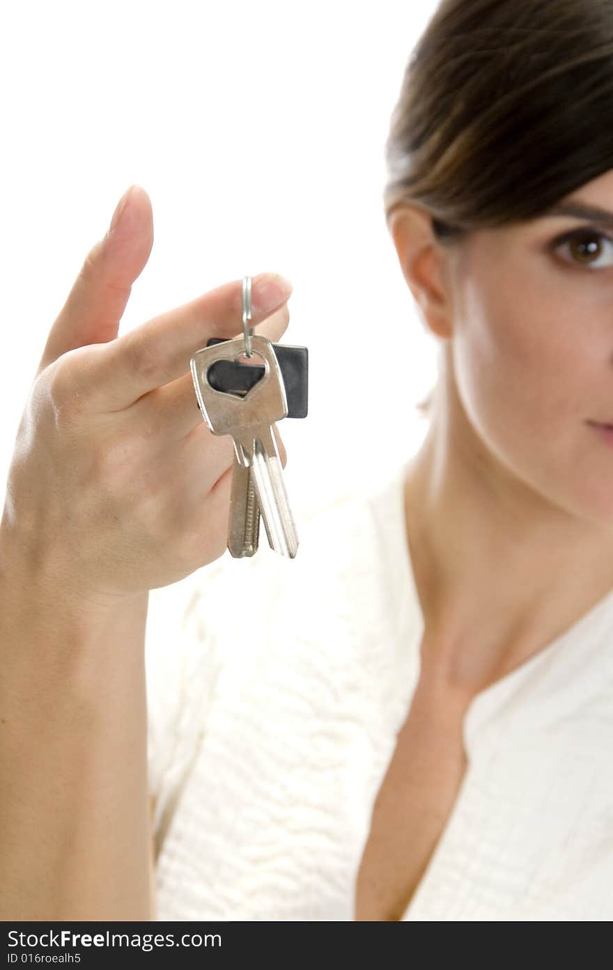 Lady with keys in her finger with white background