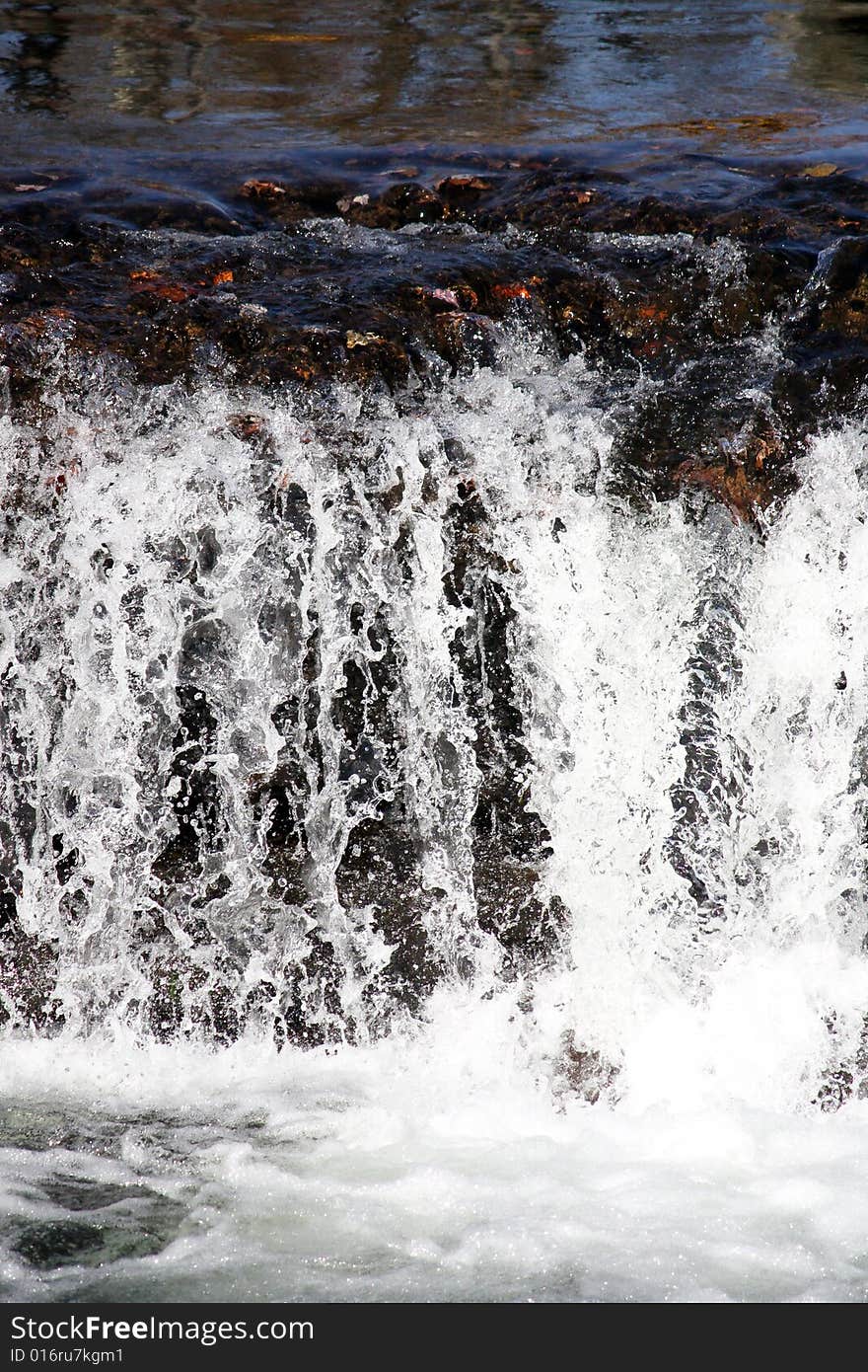 Clean mountain water rushing down the river in October. Clean mountain water rushing down the river in October