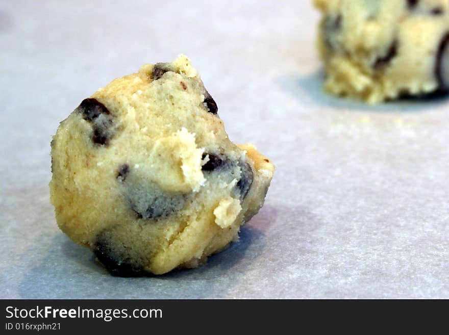 Chocolate chip cookie dough on parchment paper