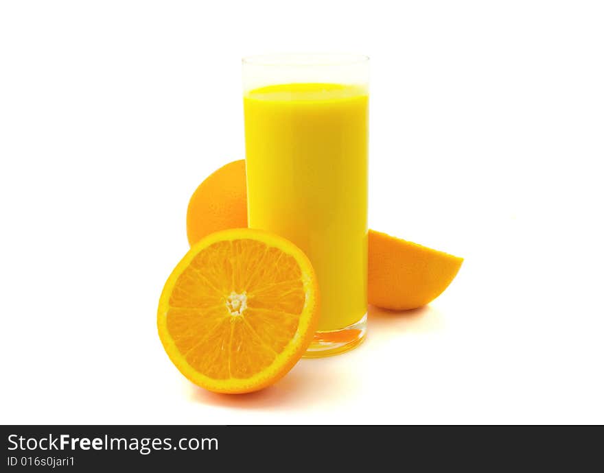 Glass of orange juice and oranges isolated