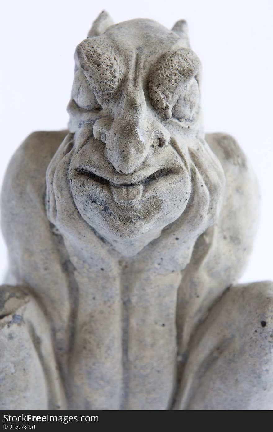 Scary gargoyle statue on white background.