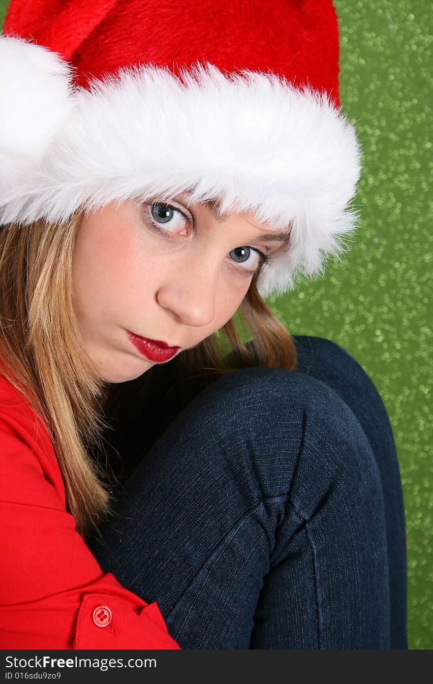 Teenager with red lips wearing a christmas hat. Teenager with red lips wearing a christmas hat