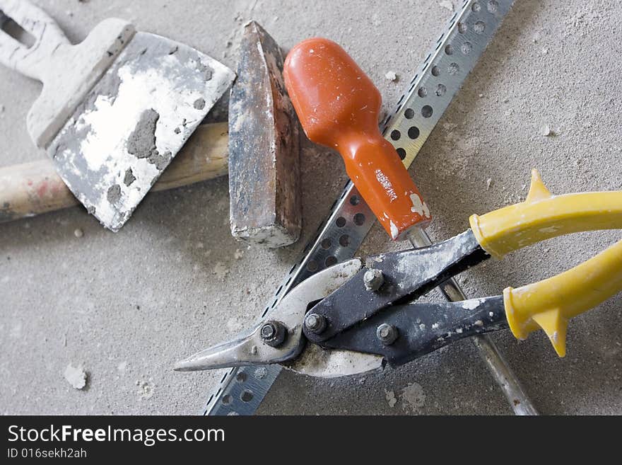 The tool prepared for work is spread out on a floor, the top view. The tool prepared for work is spread out on a floor, the top view