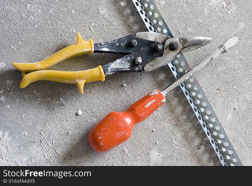 The tool prepared for work is spread out on a floor, the top view. The tool prepared for work is spread out on a floor, the top view