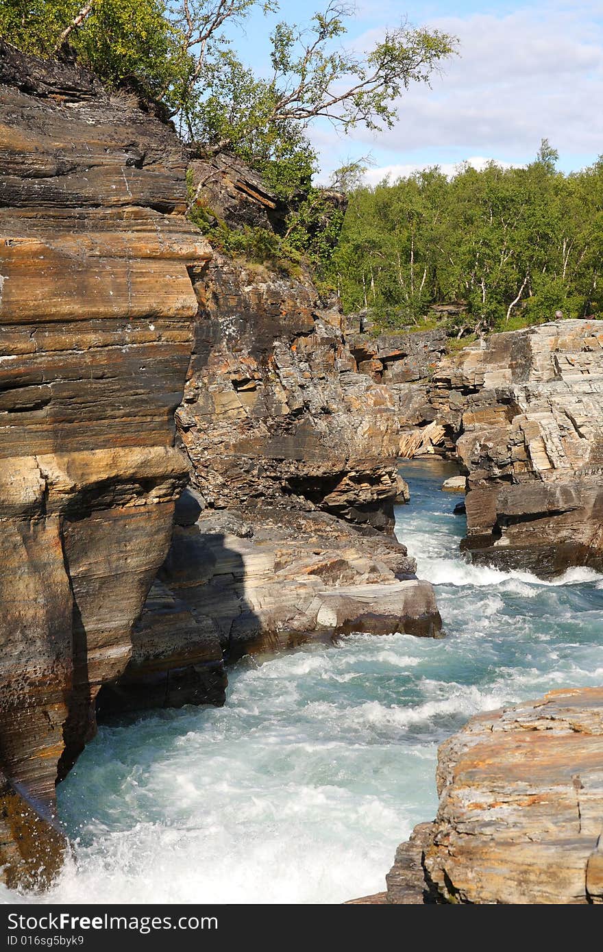 Flowing river through canyon, Abisko National Park in Sweden