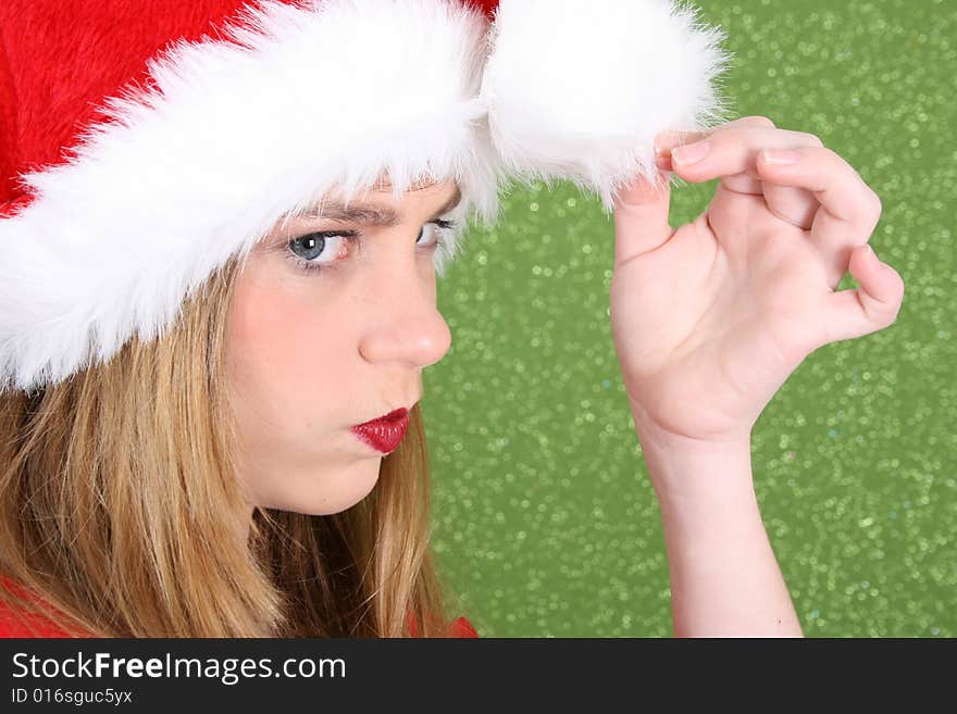 Teenager with red lips wearing a christmas hat. Teenager with red lips wearing a christmas hat