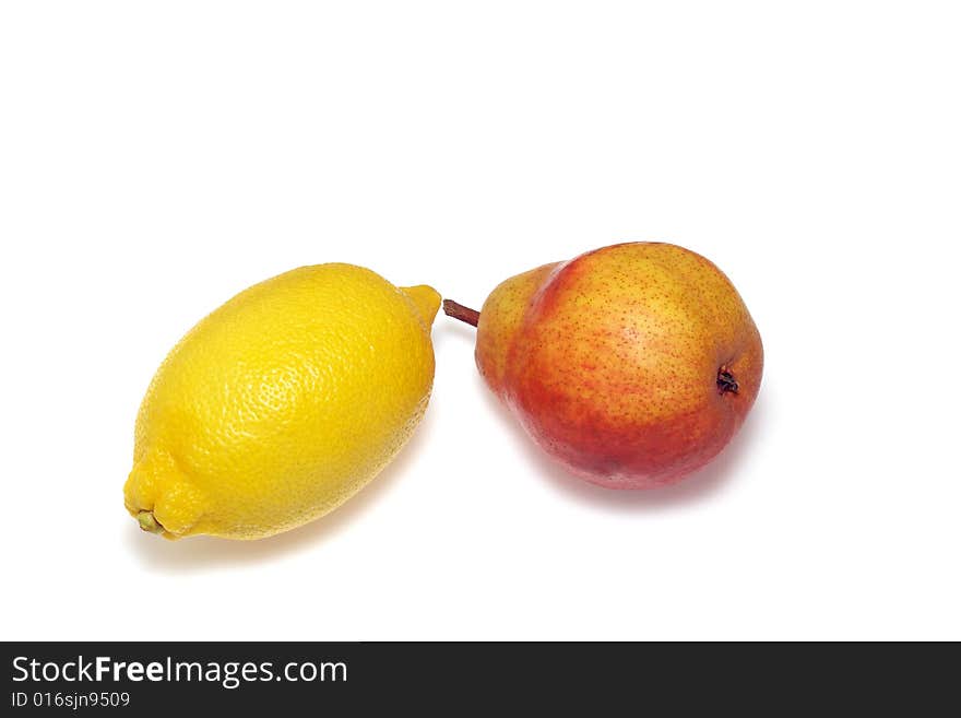 Fresh yellow lemon and red pear isolated on white background