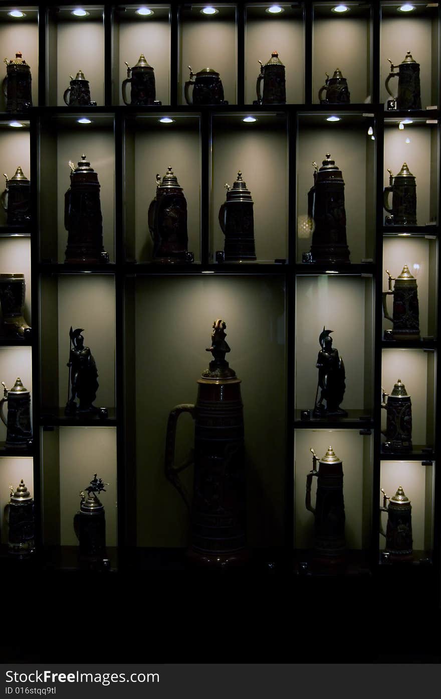 Collection of wine jugs on shelves