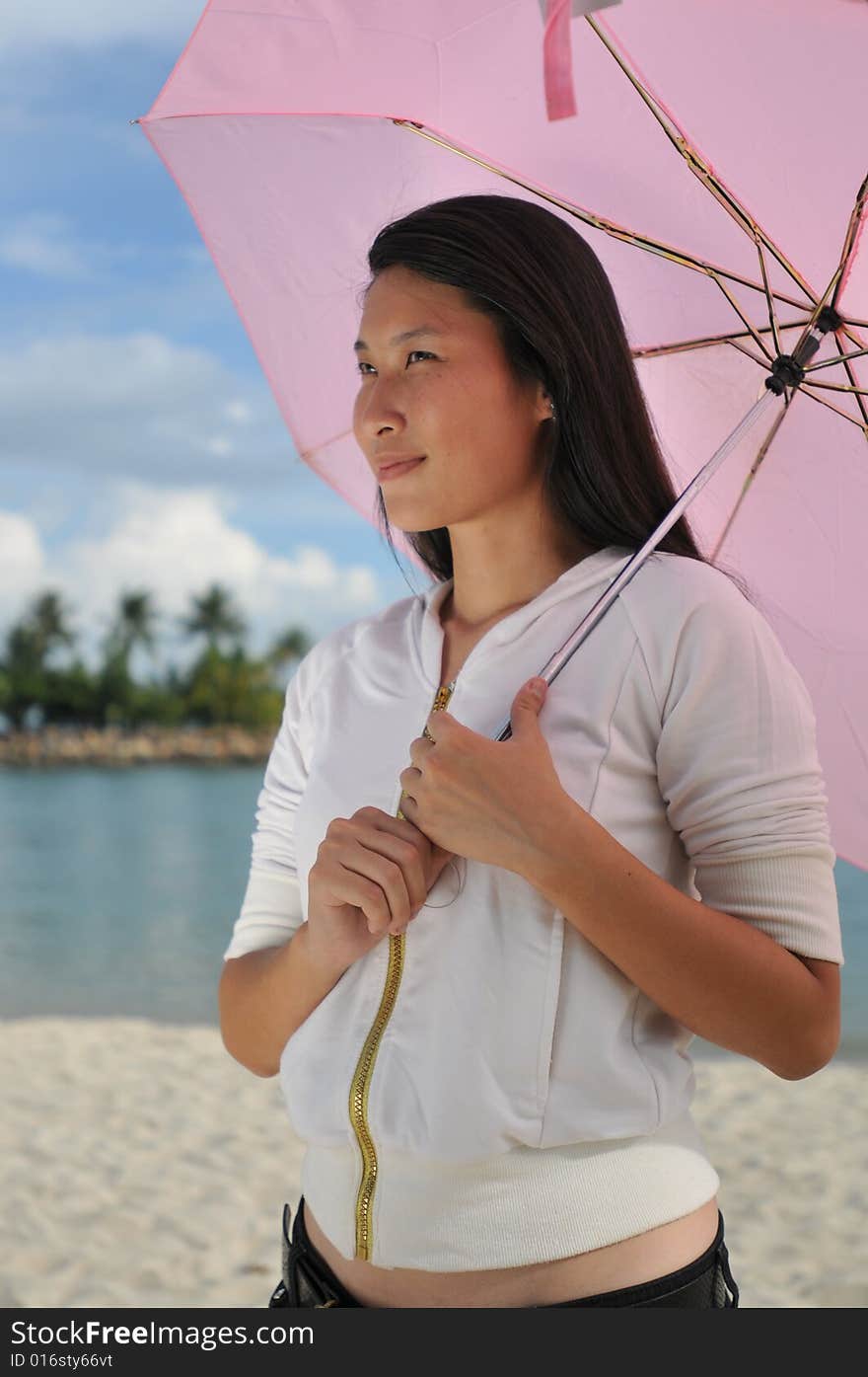 Woman with umbrella the beach. Woman with umbrella the beach.