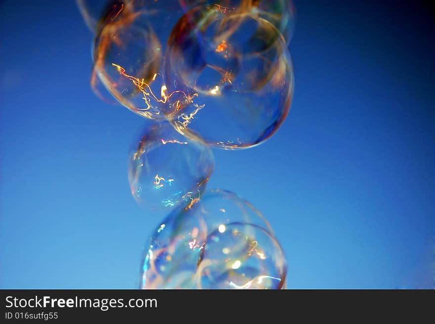 Enhanced shot of a stream of bubbles from a children's toy. Enhanced shot of a stream of bubbles from a children's toy