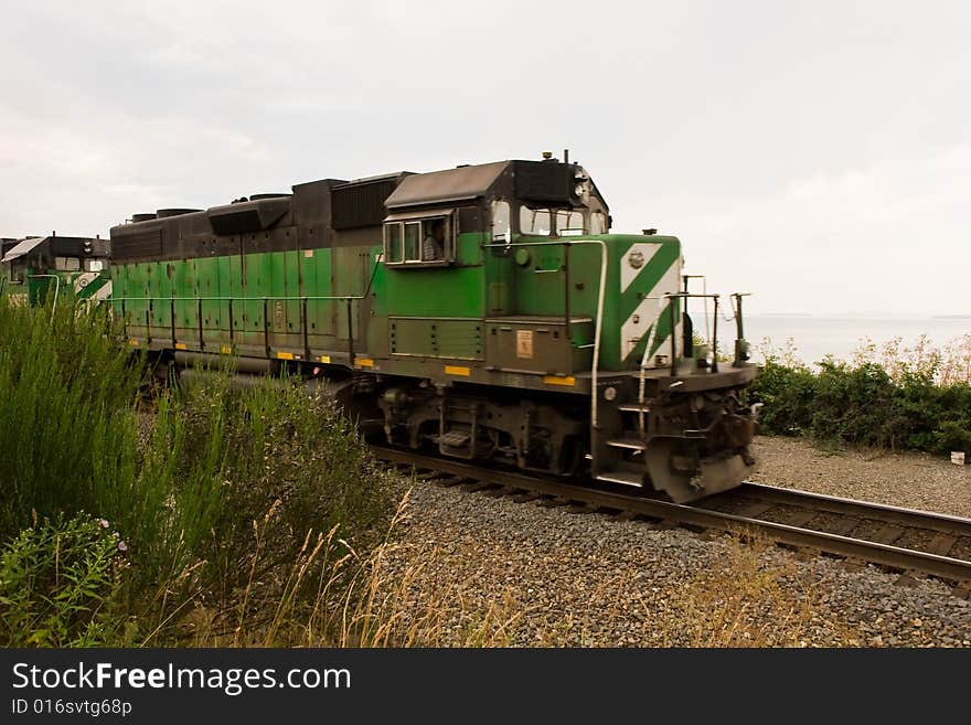 Green Train on Edge of Sea