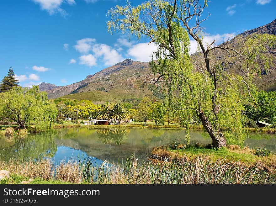 Lake and awesome mountains. Shot in flyfishing farm near Jonkershoek Nature Reserve, Stellenbosch, Western Cape, South Africa.