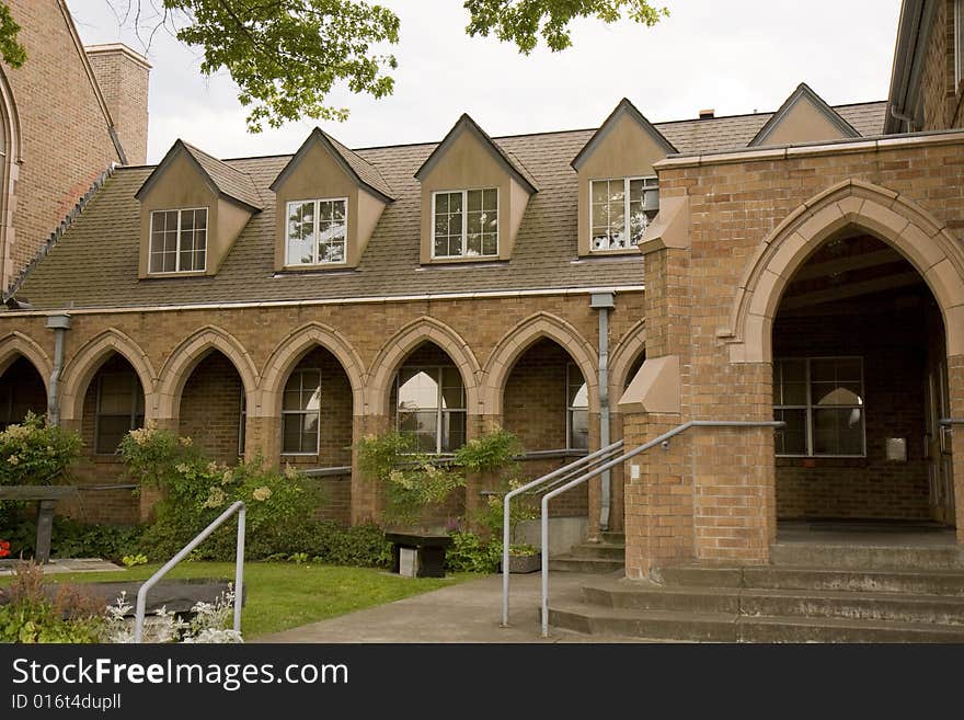 An old brick presbyterian church with arched walkways. An old brick presbyterian church with arched walkways