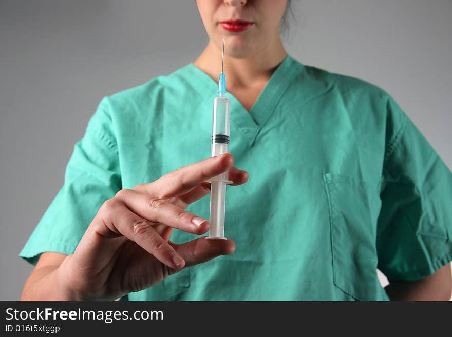 a doctor holding a syringe