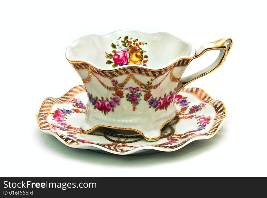 Teacup with dish decorated with flowers