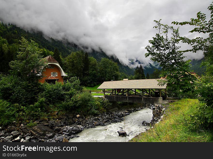 Mountains, the river and cloudy sky. Mountains, the river and cloudy sky