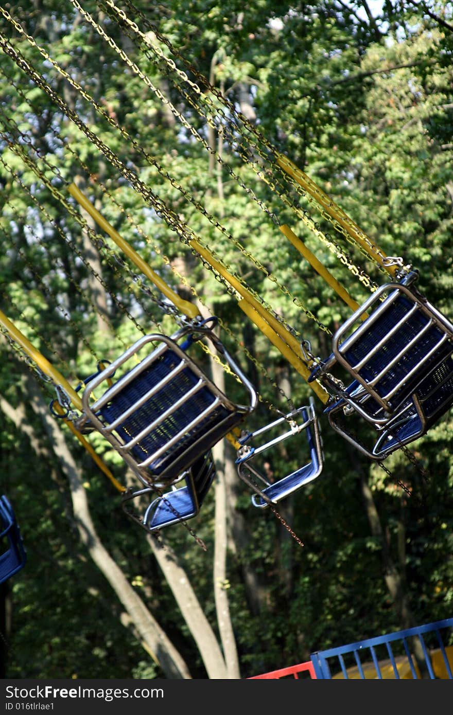 Picture of a flying swing at the amusement park. Picture of a flying swing at the amusement park.