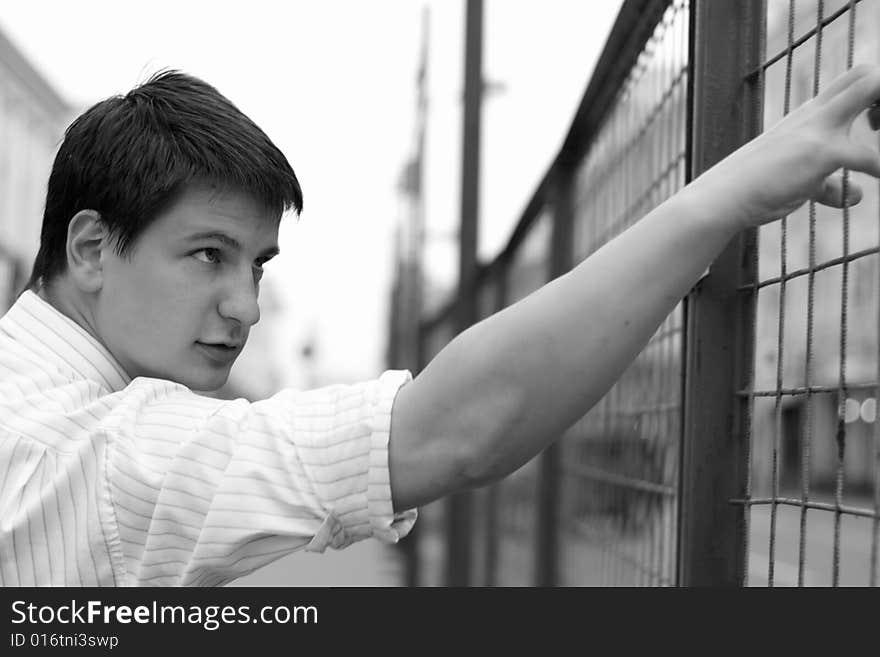 The Young Man Pushes An Iron Lattice