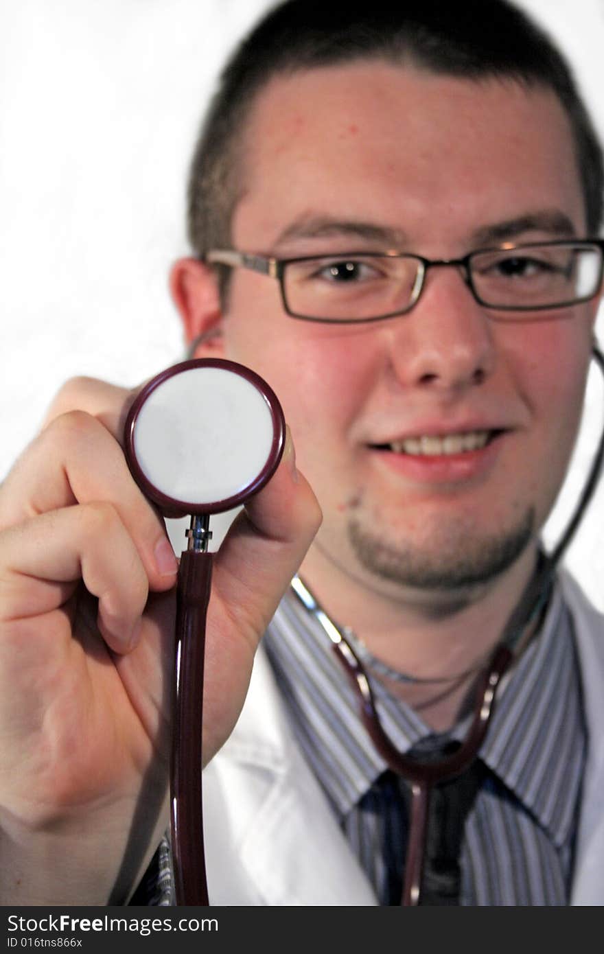 Doctor holding stethoscope in his arm