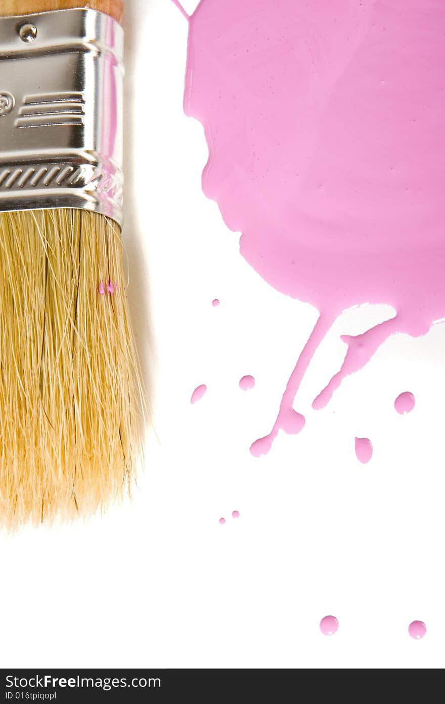 Paintbrush and pink paint