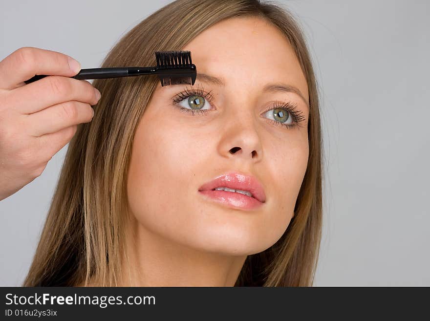 Pretty Woman Applying Make Up.