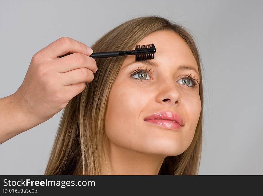 Pretty Woman Applying Make Up.