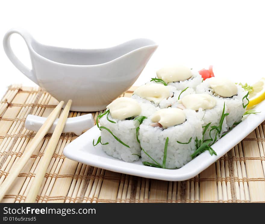 Rolls with Sauce and Greens on Bamboo Napkin Served with Soy Sauce an Chopsticks. Rolls with Sauce and Greens on Bamboo Napkin Served with Soy Sauce an Chopsticks