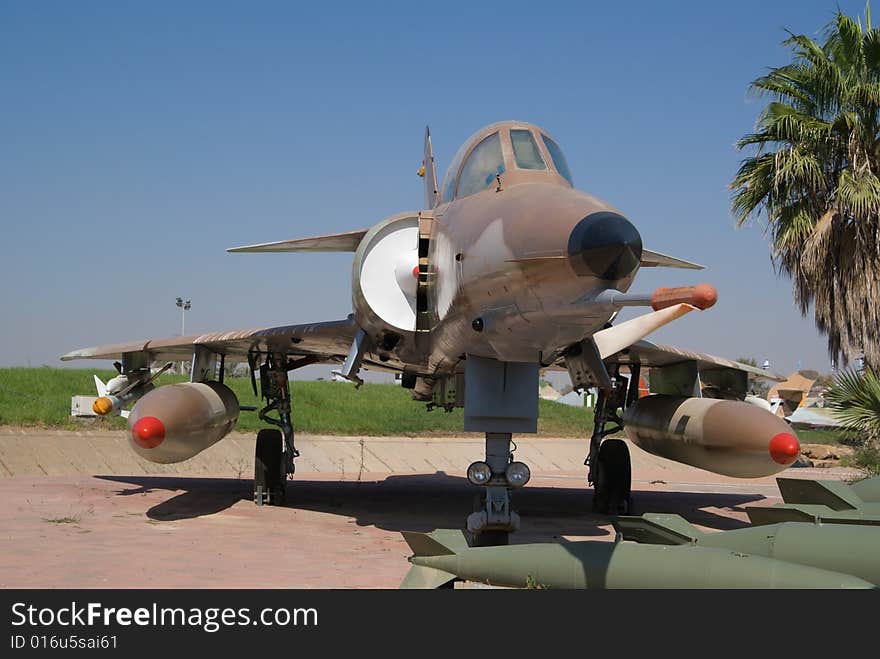 Military fighter jet parked on an airstrip. Military fighter jet parked on an airstrip