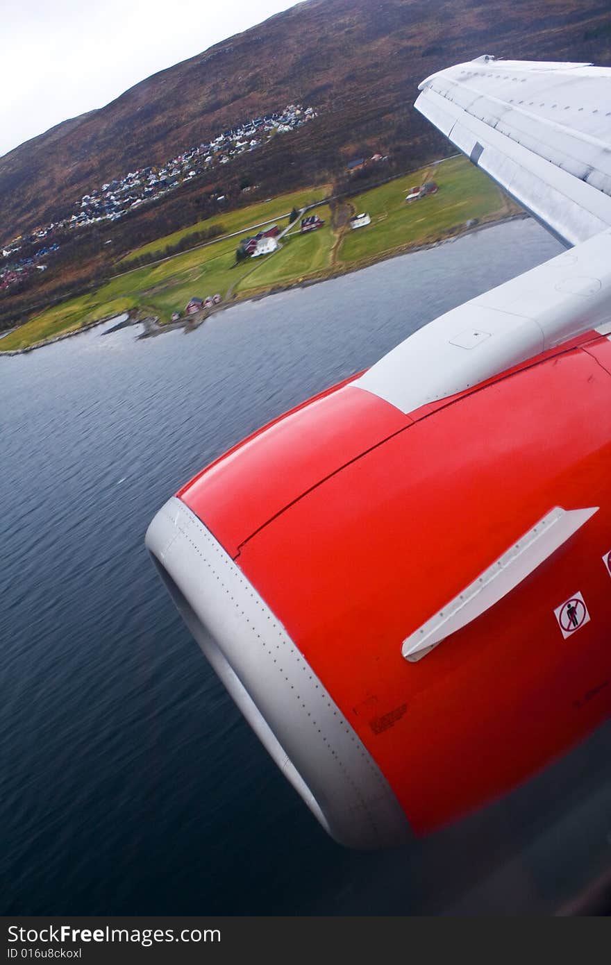 A norwegian airplane going in for landing in Tromso (norwegian: Tromsø). A norwegian airplane going in for landing in Tromso (norwegian: Tromsø)