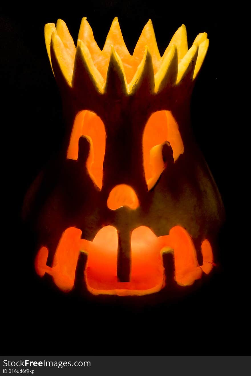 Grinning Halloween lantern over black background