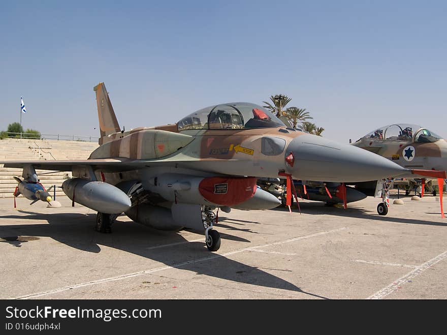 Military fighter jet parked on an airstrip. Military fighter jet parked on an airstrip