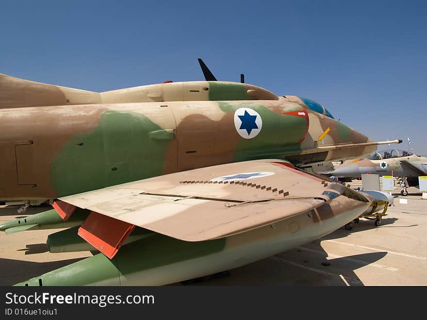 Military fighter jet parked on an airstrip. Military fighter jet parked on an airstrip