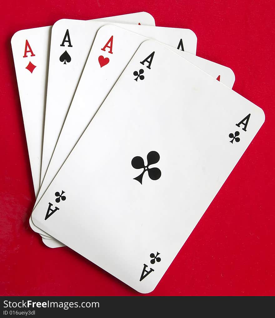 Four aces on the red background