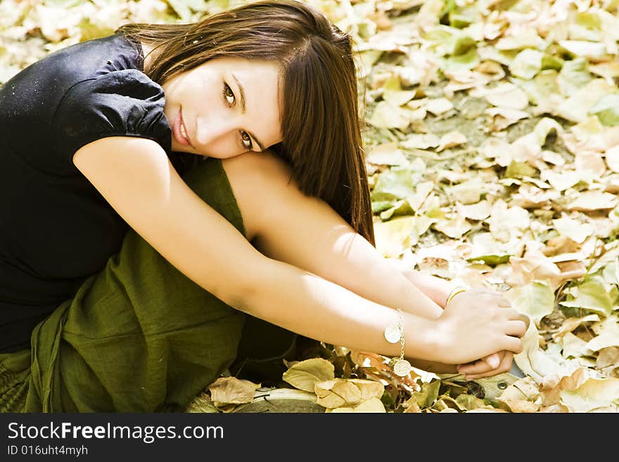 Young woman in autumn background