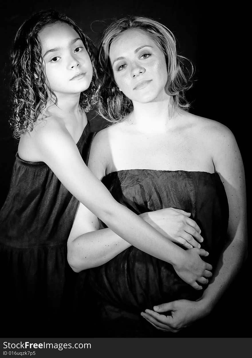 A young family, photographed in the studio.