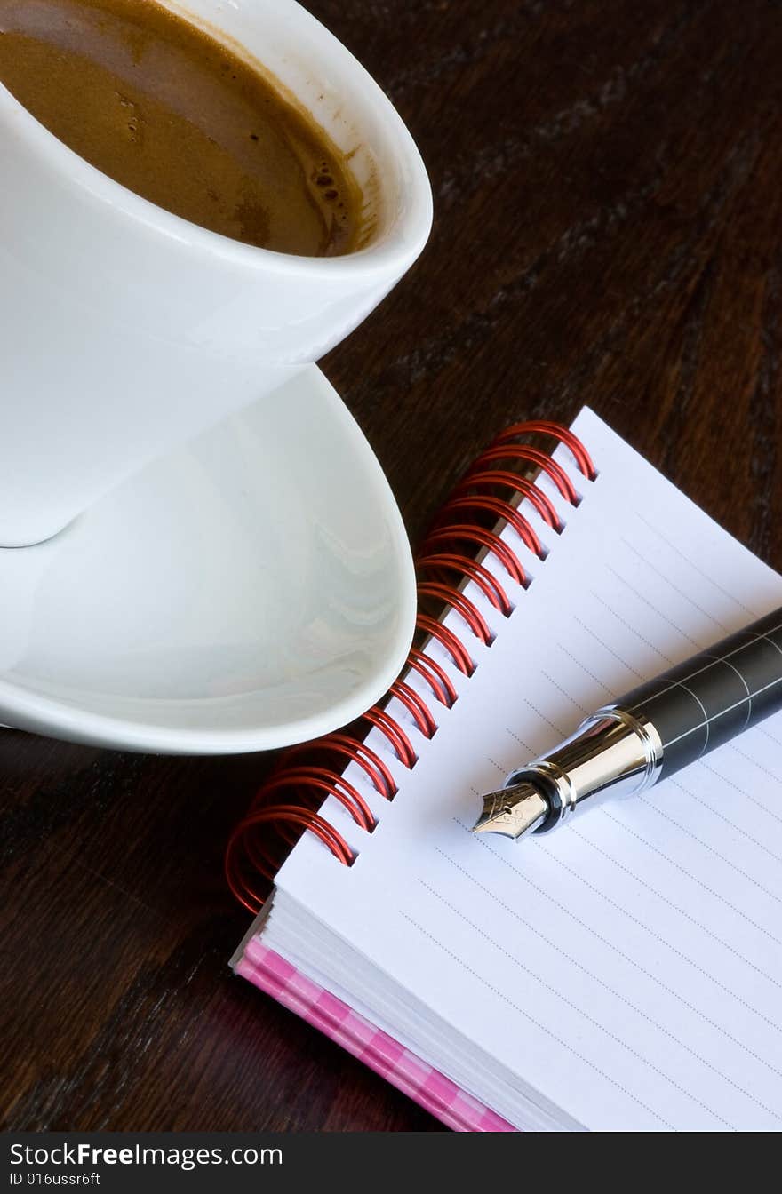 Cyprus coffee and  spiral notebook with a point pen. Cyprus coffee and  spiral notebook with a point pen.