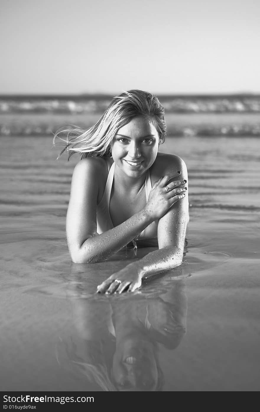 Sexy Blond laying on the beach in a Bikini. Sexy Blond laying on the beach in a Bikini