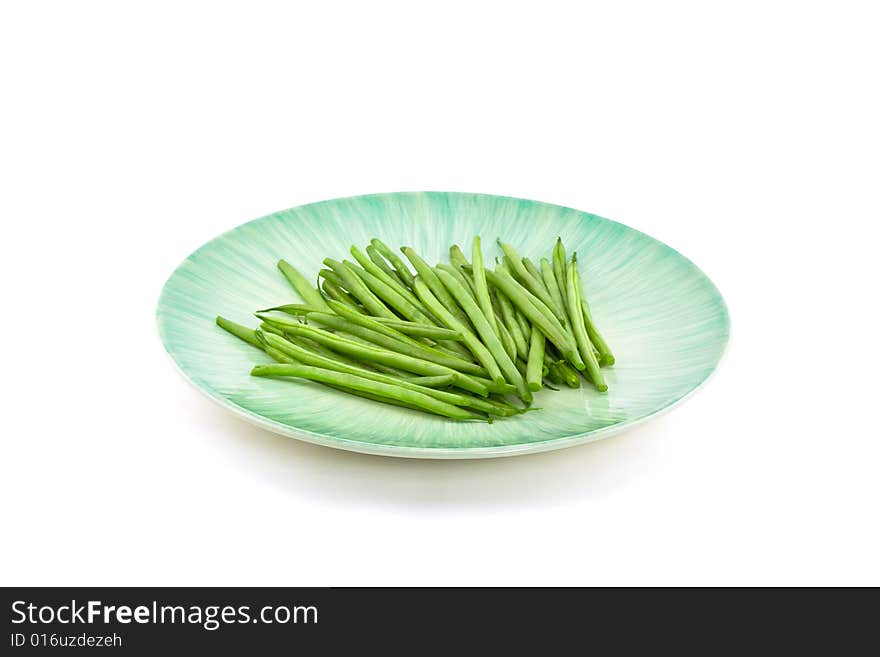 Green Beans on Turquoise Ceramic Plate with White Background