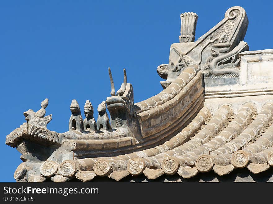 Traditional and beautiful fastigium with a lot of mythical animals,the old architecture of China. Traditional and beautiful fastigium with a lot of mythical animals,the old architecture of China