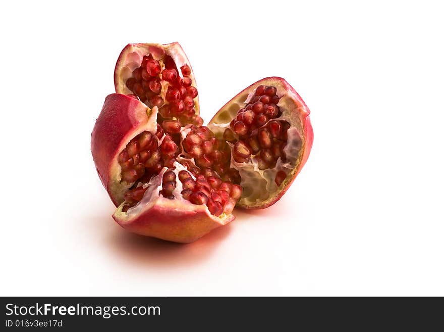 Pomegranate close-up isolated on white background