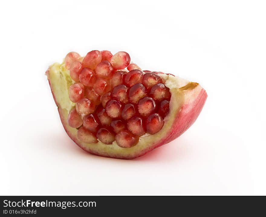 Pomegranate close-up isolated on white background