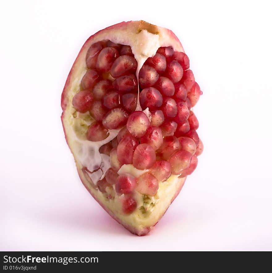 Pomegranate close-up isolated on white background