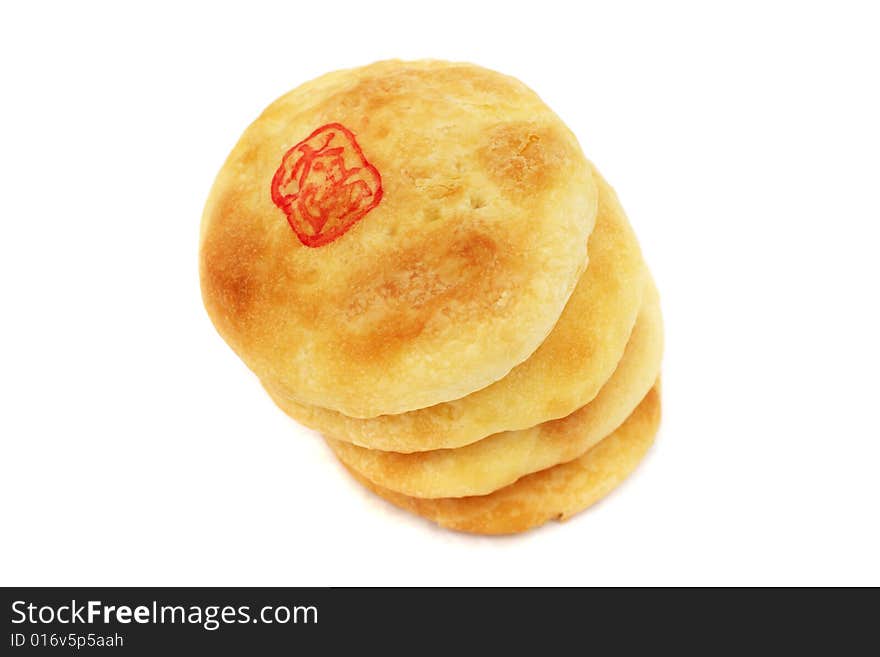 Chinese cream pastry stacked together on white background.